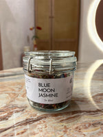 Jar labeled 'Blue Moon Jasmine' on a marble surface