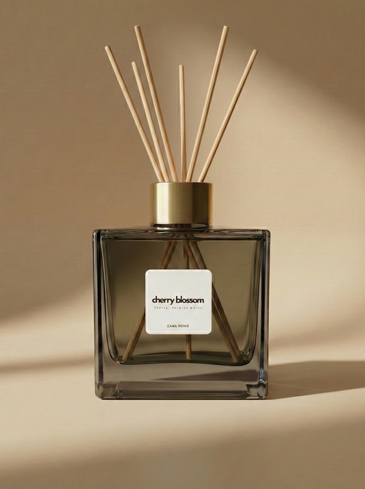 Reed diffuser labeled 'cherry blossom' on a beige background