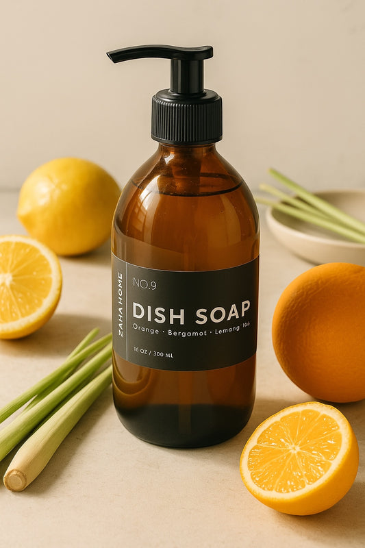 Brown dish soap bottle with pump on a beige surface with lemons and limes.