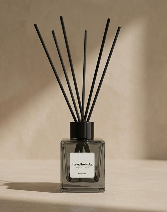 Diffuser with black sticks on a beige background