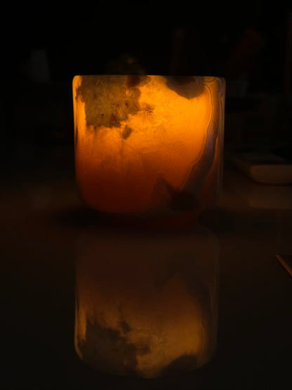 Handcrafted Egyptian transparent onyx marble candle showing unique natural stone veining