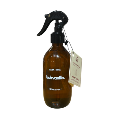 Brown spray bottle with black nozzle labeled 'lushvanilla' on a white background