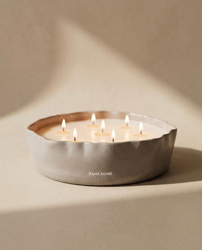 Scented Candle holder with multiple candles on a beige background, featuring the brand 'Zara Home'.