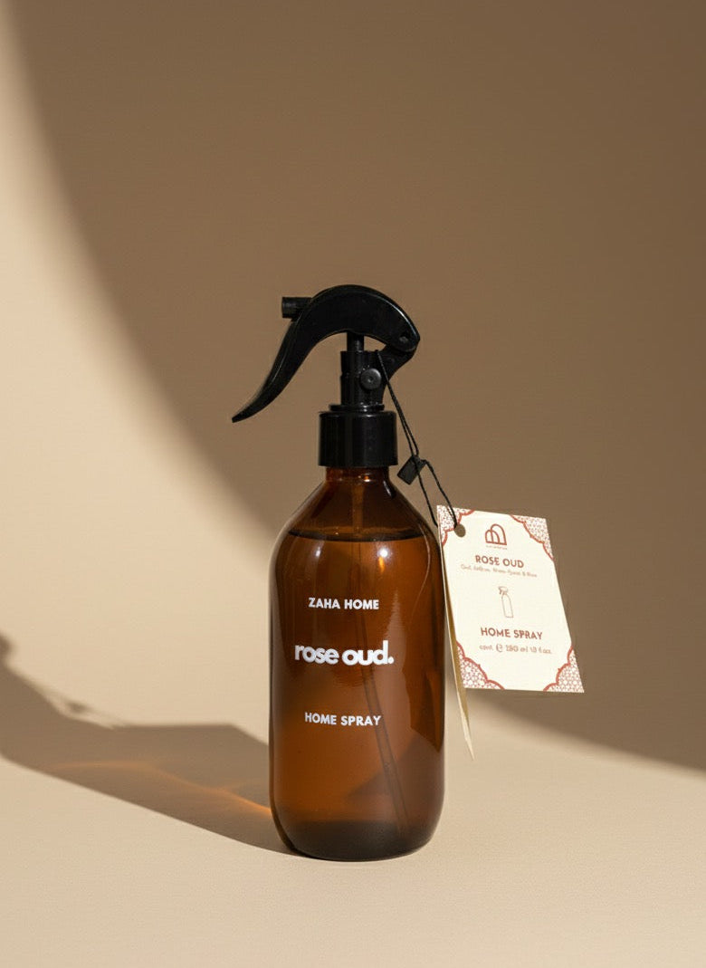 Brown spray bottle labeled 'Zara Home Rose Oud' on a beige background