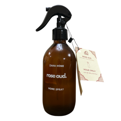 Brown spray bottle labeled 'Zaha Home Rose Oud' on a white background
