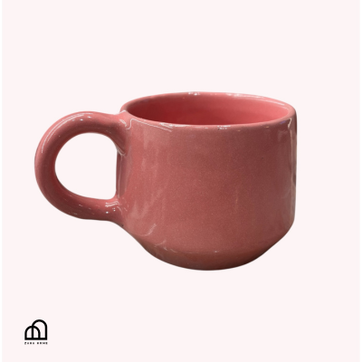 Pink ceramic mug on a white background