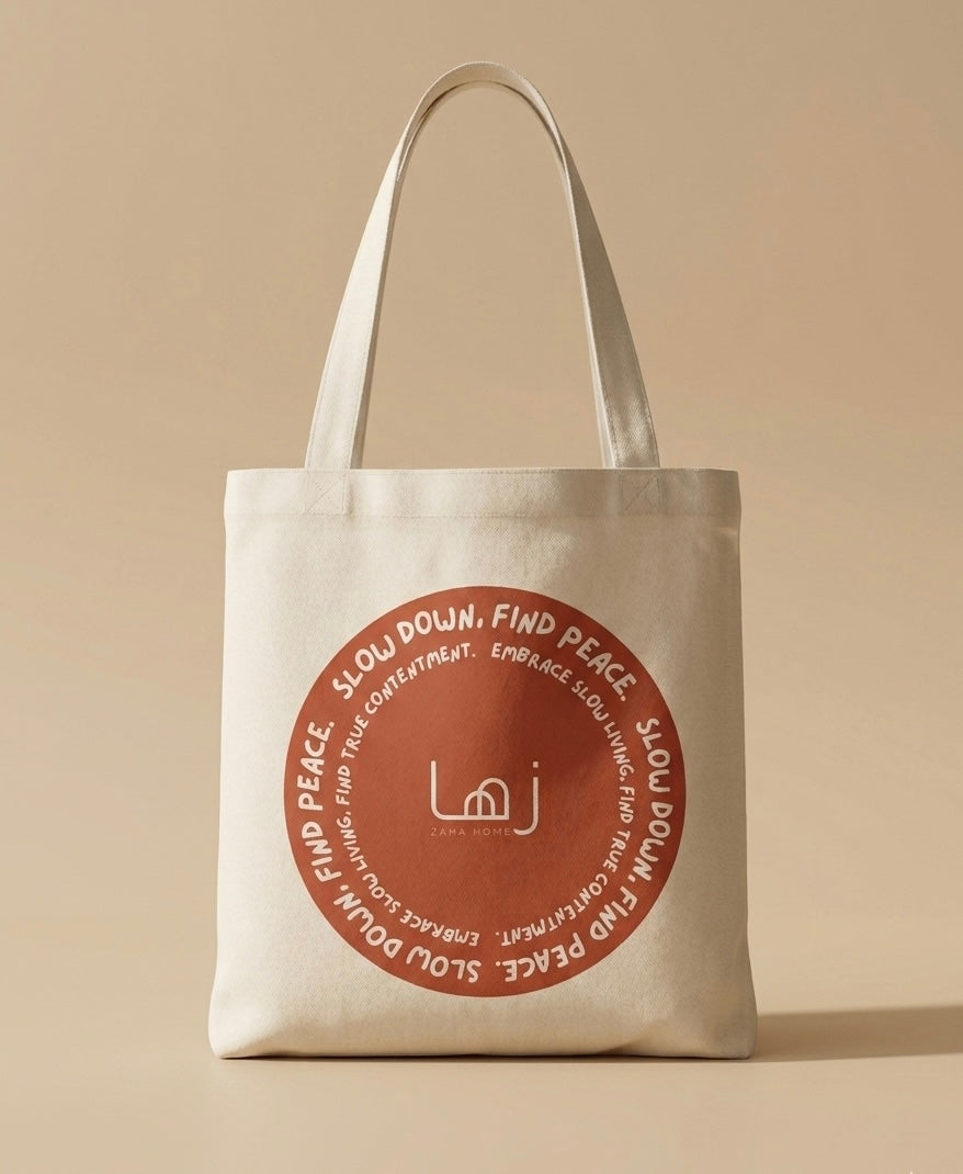 Beige tote bag with a red circular design and text on a beige background