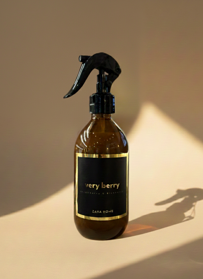Brown spray bottle with black nozzle on a beige background