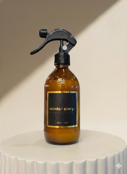 Brown spray bottle with black label on a white surface
