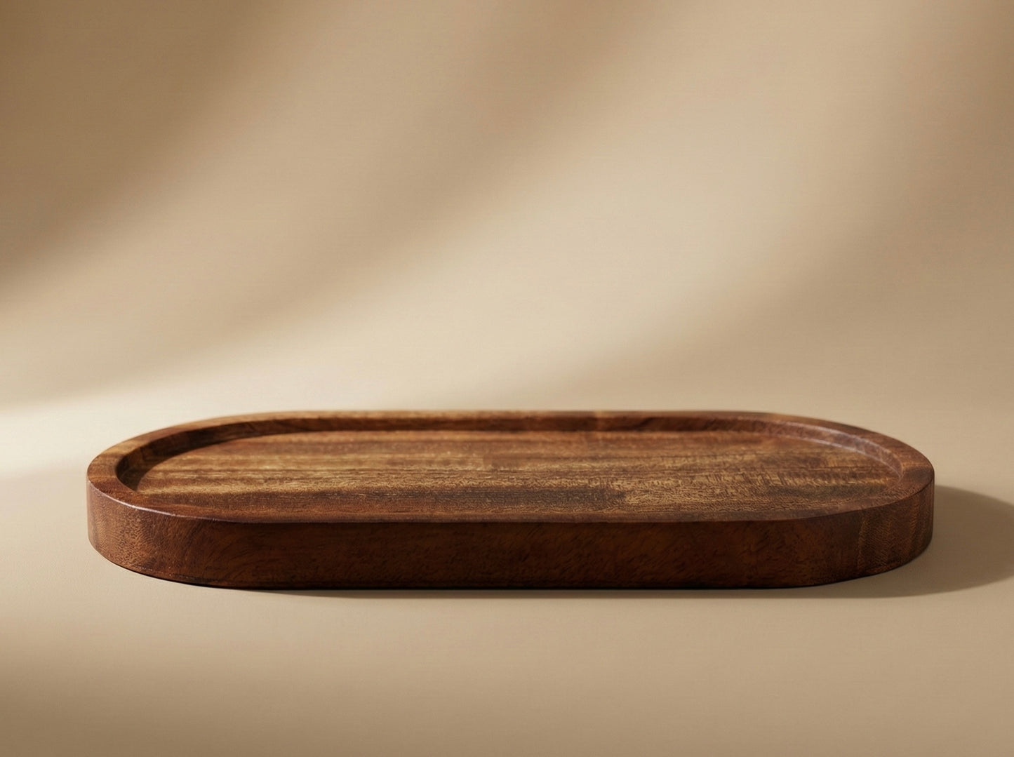 Wooden tray on a beige background